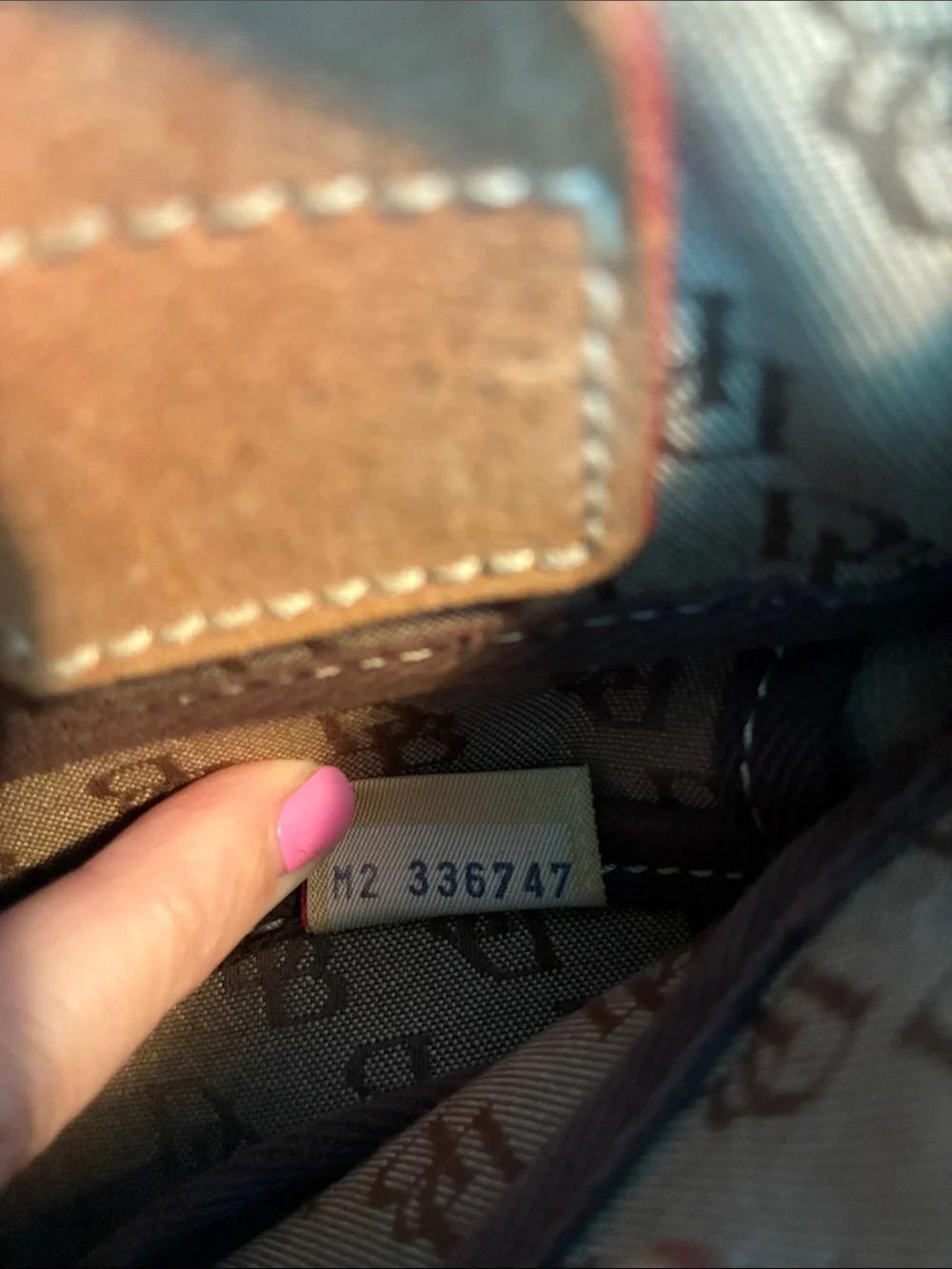 Dooney & Bourke  Brown Monogram Handbag with Tassel Accent